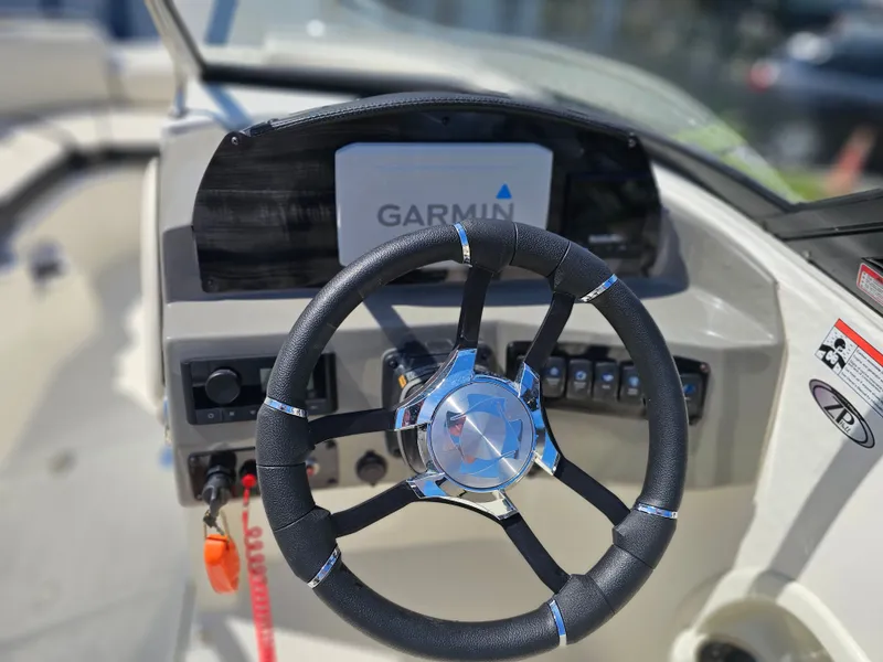 Slide: The Image of Steering wheel of Stingray 231 DC boat, year 2022. - 4