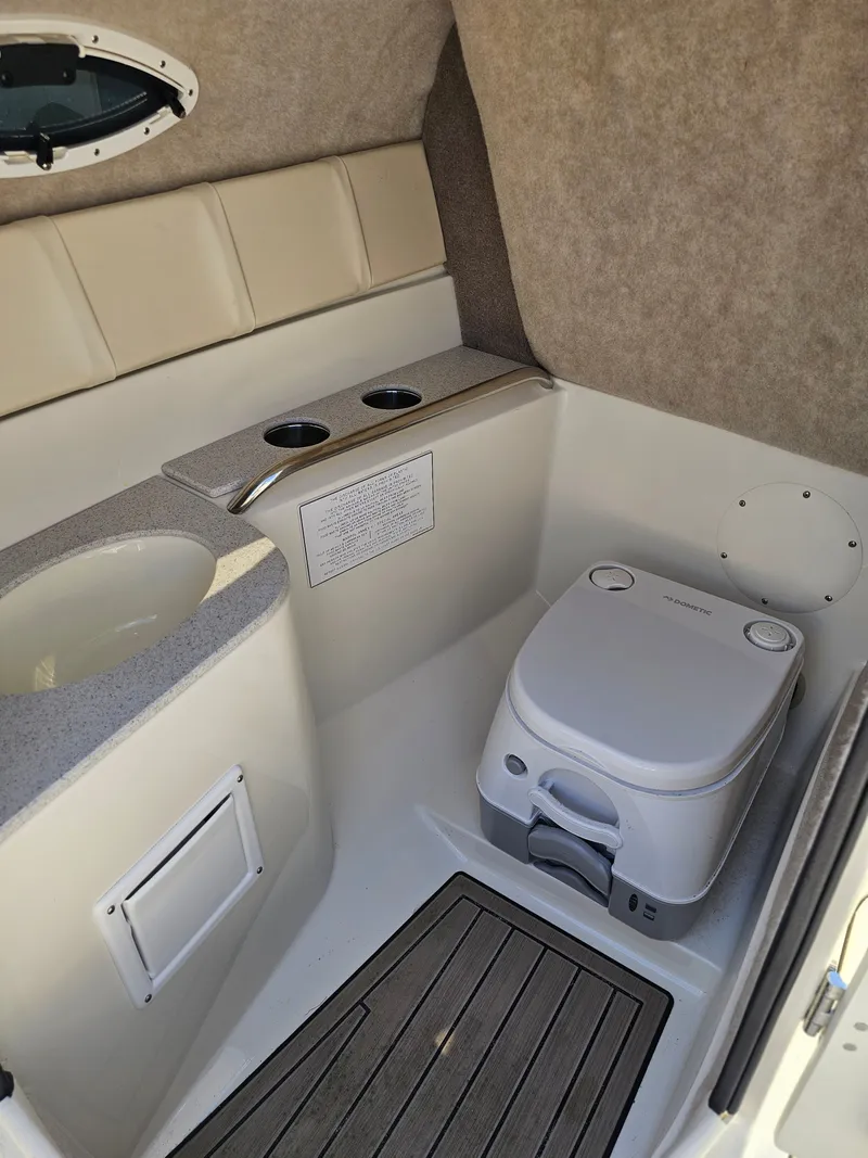 Slide: The Image of Interior of 2022 Stingray 231 DC with toilet and sink. - 8