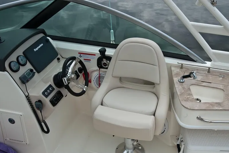 Slide: The Image of 2019 Boston Whaler 230 Vantage boat interior with white seating and sleek design. - 12