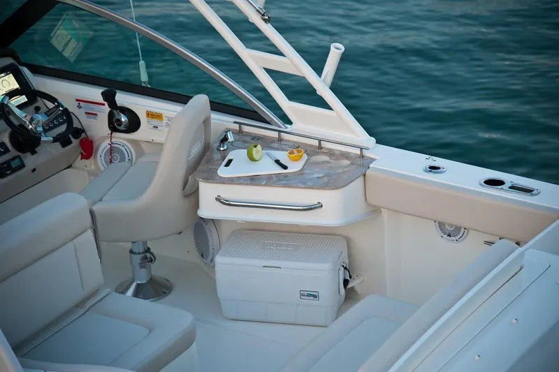 Slide: The Image of 2019 Boston Whaler 230 Vantage interior, featuring sleek white seating and modern design elements. - 13