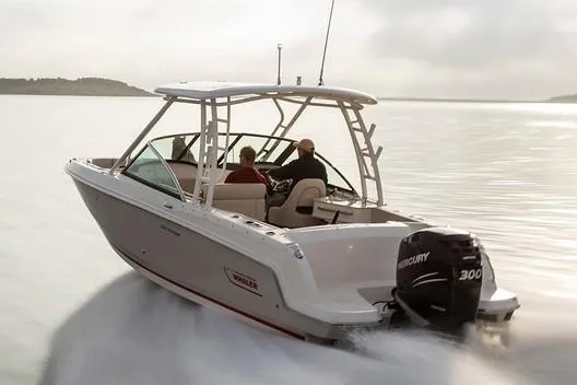 Slide: The Image of Overhead view of a 2019 Boston Whaler 230 Vantage docked by a pier. - 2