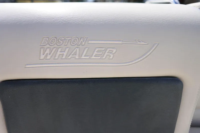 Slide: The Image of Boston Whaler 230 Vantage 2019 boat seat with embossed logo detail. - 25