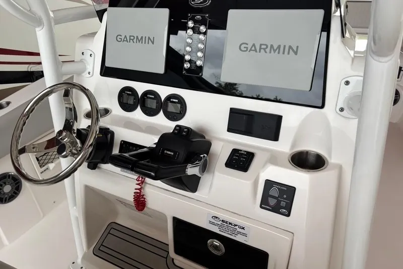 Slide: The Image of 2022 Sea Fox 268 Commander dashboard with Garmin displays and Yamaha controls. - 10