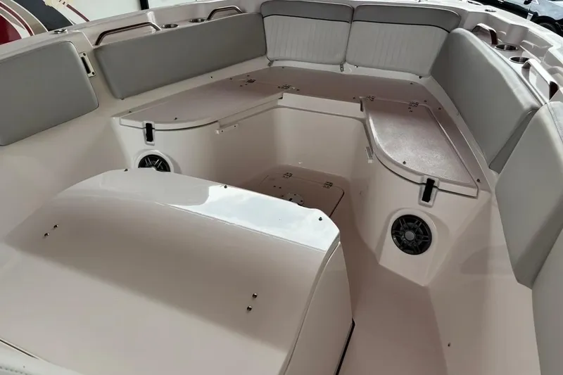 Slide: The Image of 2022 Sea Fox 268 Commander boat interior with cushioned seating and storage compartments. - 14