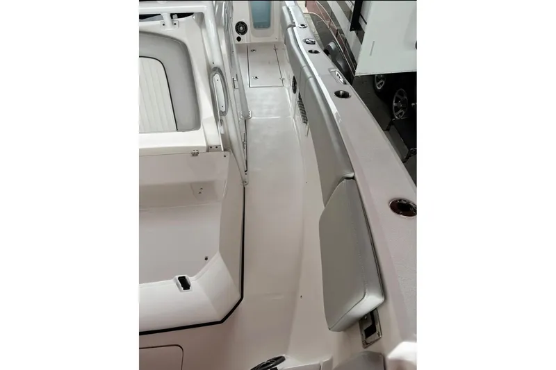 Slide: The Image of 2022 Sea Fox 268 Commander boat interior with seating and cup holders. - 16