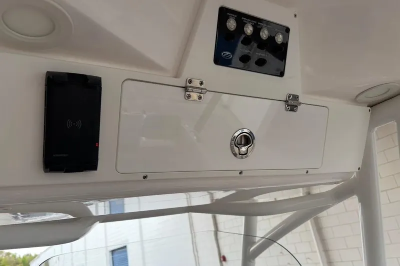 Slide: The Image of 2022 Sea Fox 268 Commander console with control panel and storage compartment. - 20