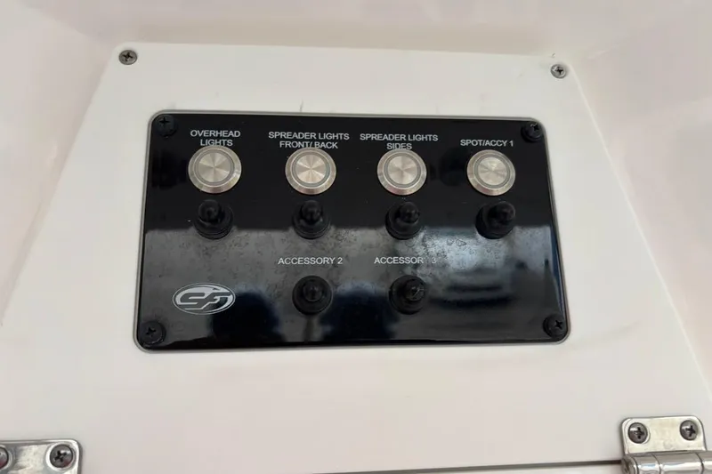 Slide: The Image of Control panel of a 2022 Sea Fox 268 Commander boat with labeled switches. - 21