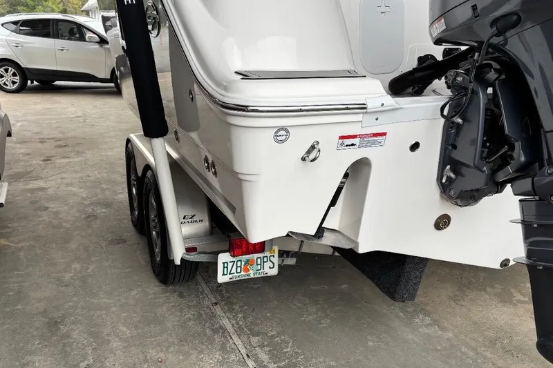 Slide: The Image of 2022 Sea Fox 268 Commander boat on trailer, rear view with outboard motor. - 5