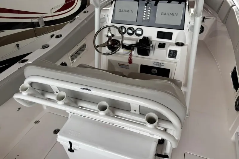 Slide: The Image of 2022 Sea Fox 268 Commander boat cockpit with Garmin displays and steering wheel. - 9