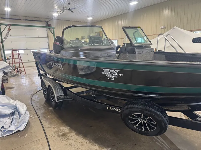 Slide: The Image of 2026 Lund Pro-V 2075 Sport boat in a workshop. - 3