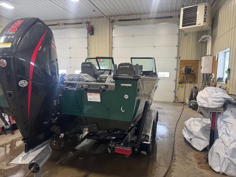 Slide: The Image of 2026 Lund Pro-V 2075 Sport boat in a workshop. - 5