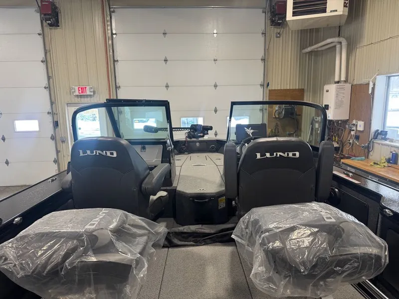 Slide: The Image of 2026 Lund Pro-V 2075 Sport boat interior in garage. - 8