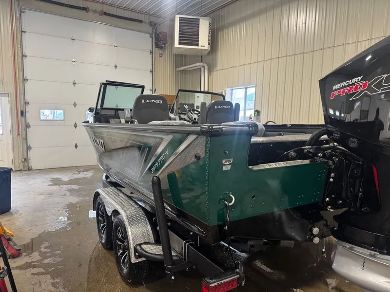 Slide: The Image of 2026 Lund Pro-V 2075 Sport boat in a workshop. - 9