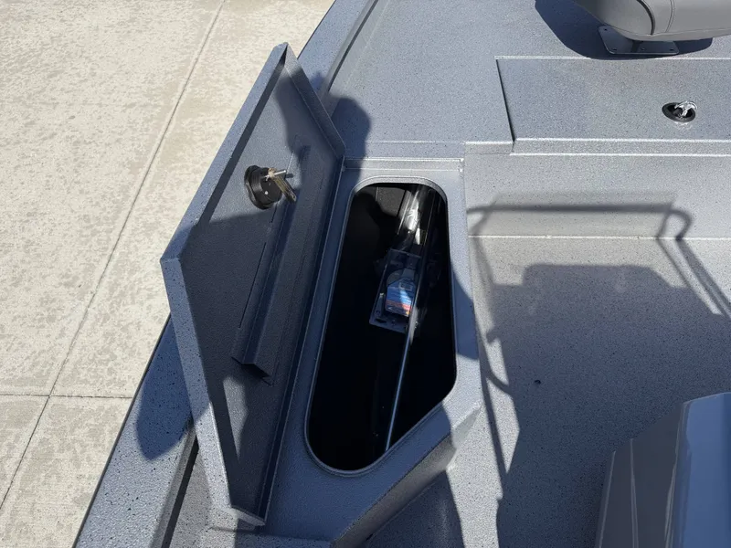 Slide: The Image of 2026 Xpress H20B boat with open storage compartment. - 23