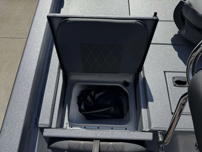 Slide: The Image of Xpress H20B 2026 boat with open storage compartment. - 30