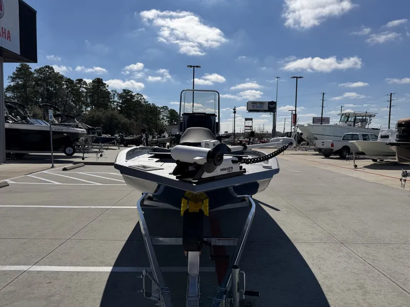 Slide: The Image of 2026 Xpress H20B boat on a trailer outdoors. - 5