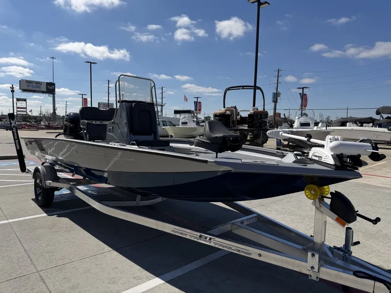 Slide: The Image of 2026 Xpress H20B boat on trailer under sunny skies. - 6