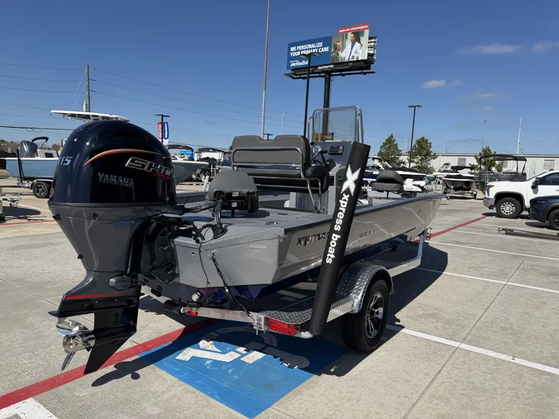 Slide: The Image of 2026 Xpress H20B boat with Yamaha engine in parking lot. - 8