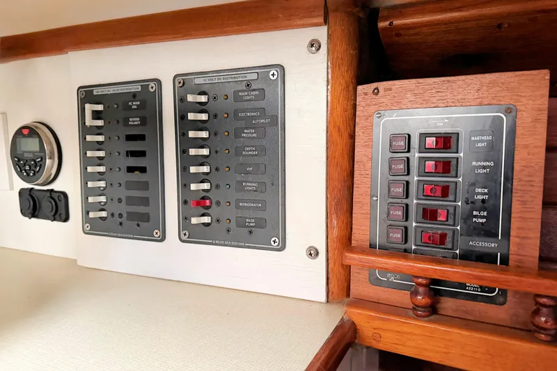 Slide: The Image of Electrical control panel on a 1967 Columbia Constellation boat, featuring switches and fuses. - 101