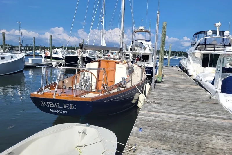 Slide: The Image of 1967 Columbia Constellation sailboat "Jubilee" docked at marina under clear blue sky. - 20