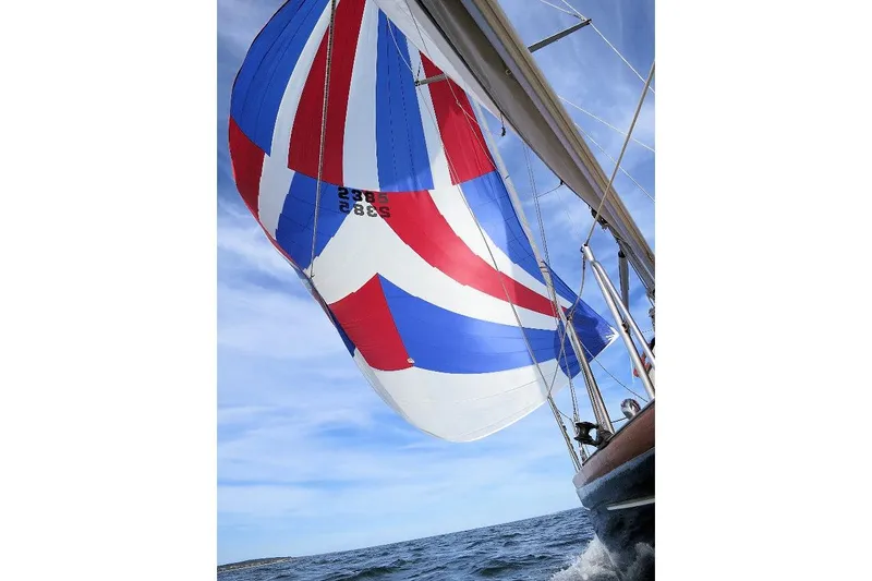 Slide: The Image of Sailing yacht Columbia Constellation 1967 with colorful spinnaker on open sea. - 43