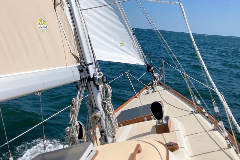 Slide: The Image of Sailing on a 1967 Columbia Constellation yacht with Doyle sails, navigating open waters. - 46