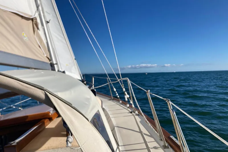 Slide: The Image of Sailing on a 1967 Columbia Constellation yacht under clear blue skies. - 47