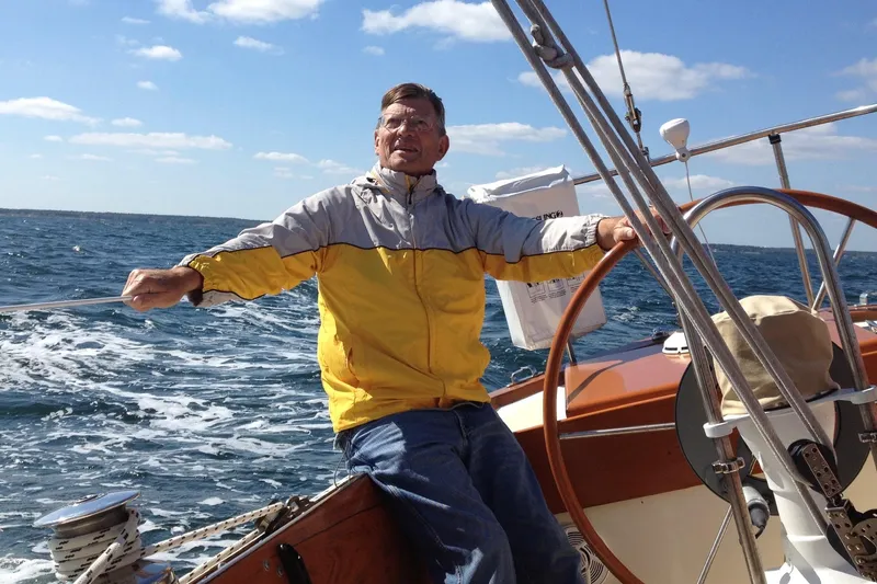 Slide: The Image of Man sailing a 1967 Columbia Constellation boat on a sunny day. - 49