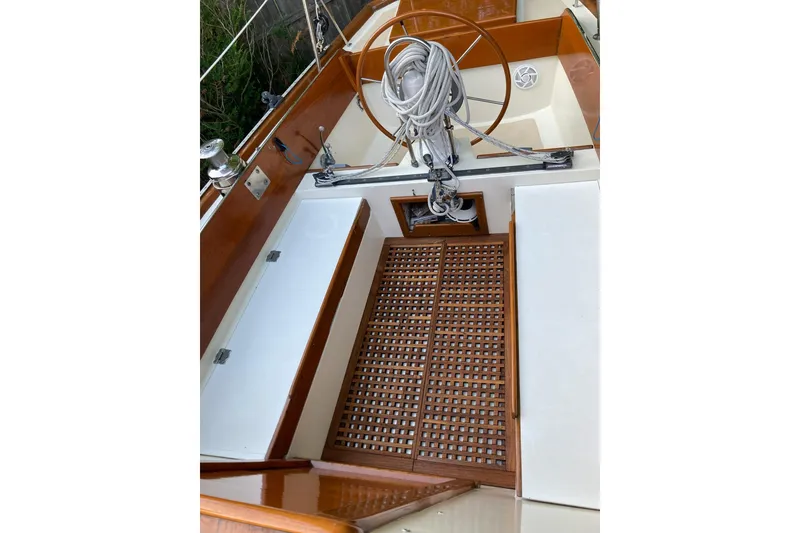 Slide: The Image of 1967 Columbia Constellation sailboat cockpit with wooden accents and steering wheel. - 61