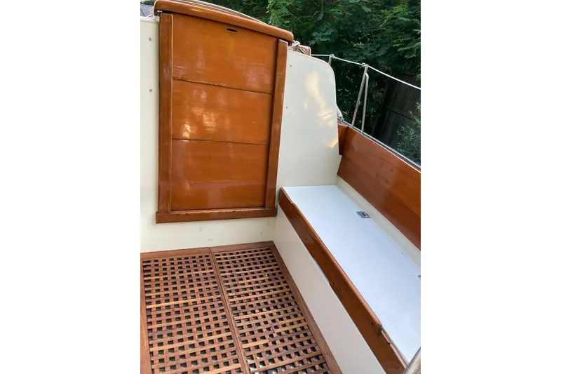 Slide: The Image of 1967 Columbia Constellation boat interior with wooden details and seating area. - 64