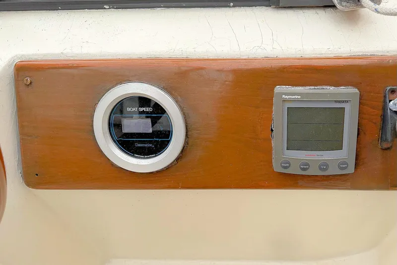 Slide: The Image of 1967 Columbia Constellation boat dashboard with speedometer and Raymarine Tridata display. - 65