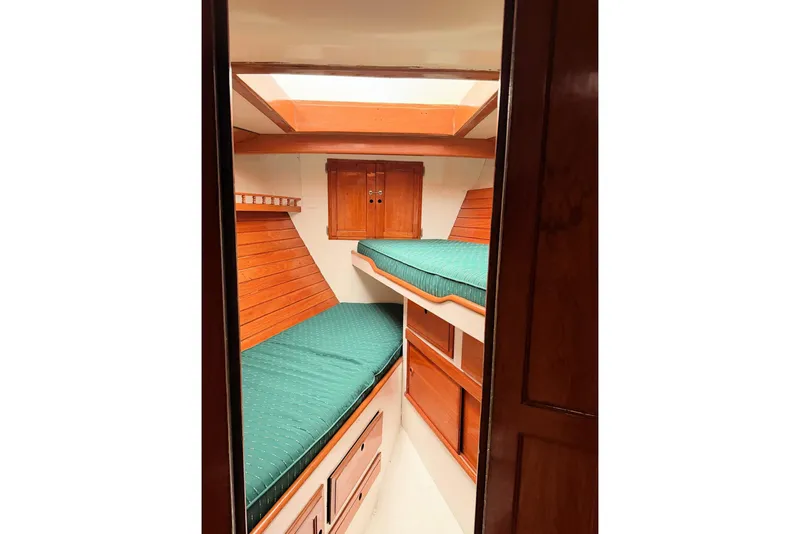 Slide: The Image of 1967 Columbia Constellation cabin interior with wooden bunks and green cushions. - 67