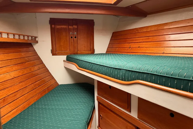 Slide: The Image of 1967 Columbia Constellation cabin interior with wooden paneling and green cushions. - 68