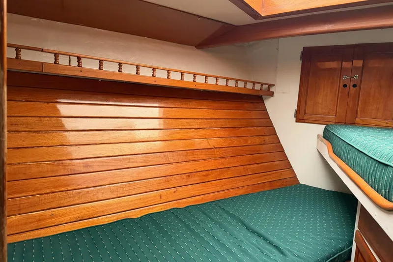 Slide: The Image of 1967 Columbia Constellation cabin interior with wooden paneling and green cushioned seating. - 70