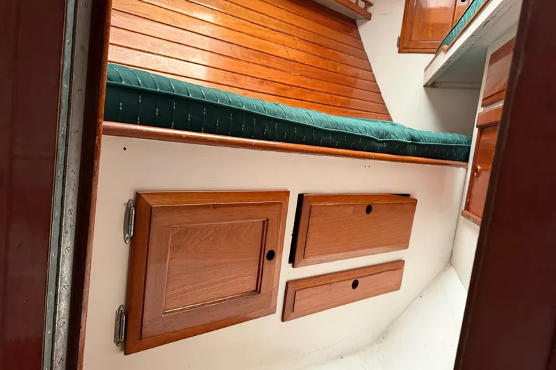 Slide: The Image of 1967 Columbia Constellation interior with wooden cabinets and green cushioned seating. - 71