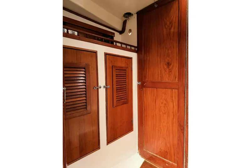 Slide: The Image of 1967 Columbia Constellation interior with wooden cabinets and doors. - 76