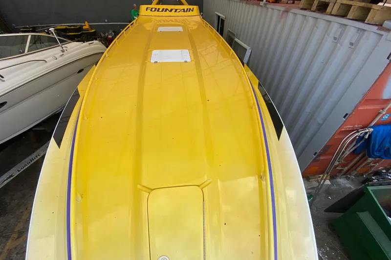 Slide: The Image of Yellow 1999 Fountain 47 Lightning boat in storage, top view. - 11