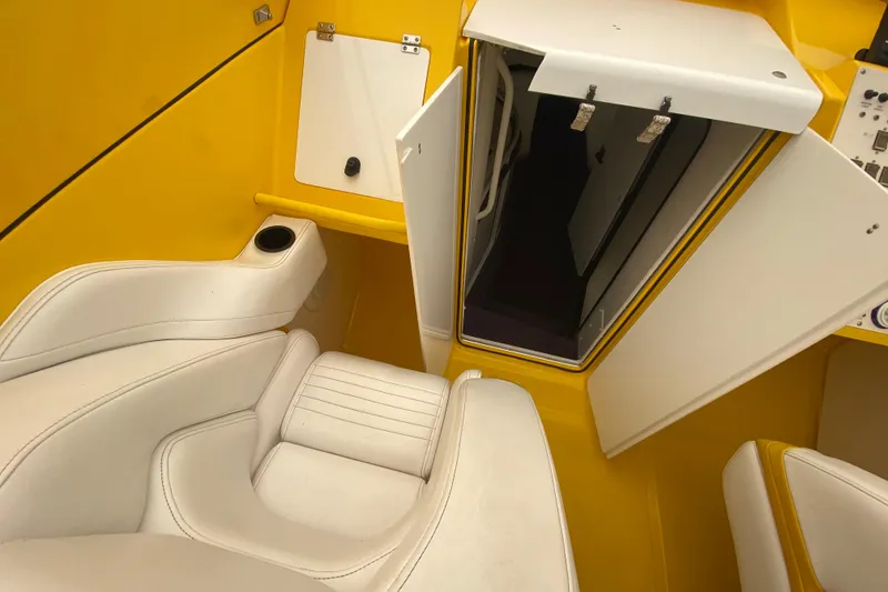 Slide: The Image of Interior of 1999 Fountain 47 Lightning boat with yellow and white seating. - 25