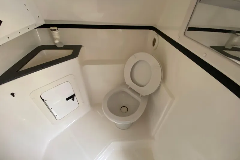 Slide: The Image of 1999 Fountain 47 Lightning boat bathroom with toilet and sink. - 28