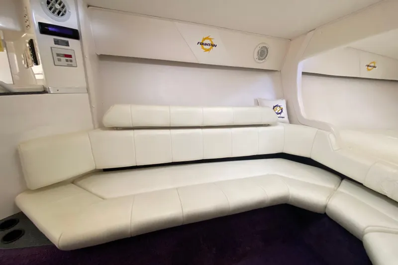 Slide: The Image of Interior of 1999 Fountain 47 Lightning boat with white leather seating and branded decor. - 32