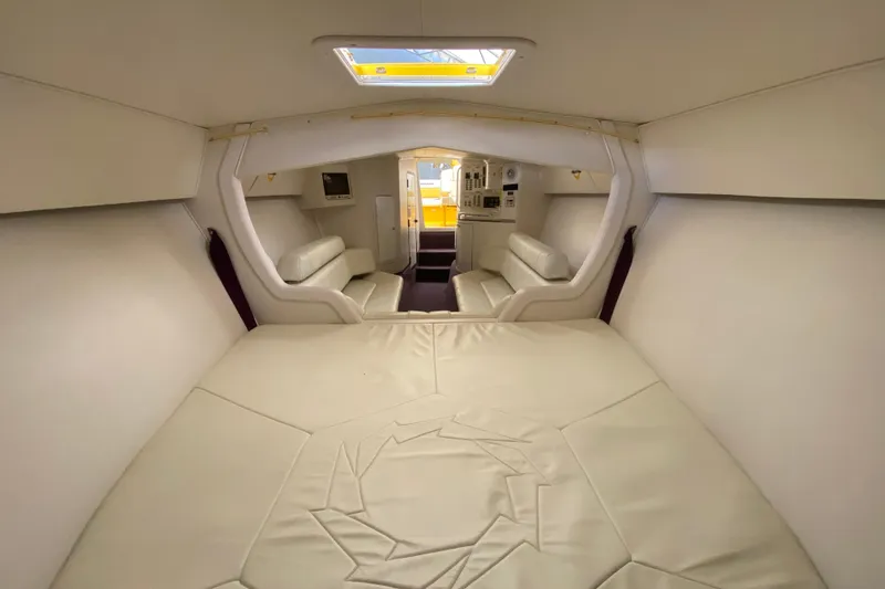 Slide: The Image of Interior of 1999 Fountain 47 Lightning boat with white leather seating and modern design. - 34