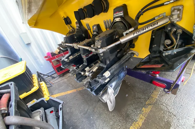 Slide: The Image of 1999 Fountain 47 Lightning boat engine components in a workshop setting. - 45