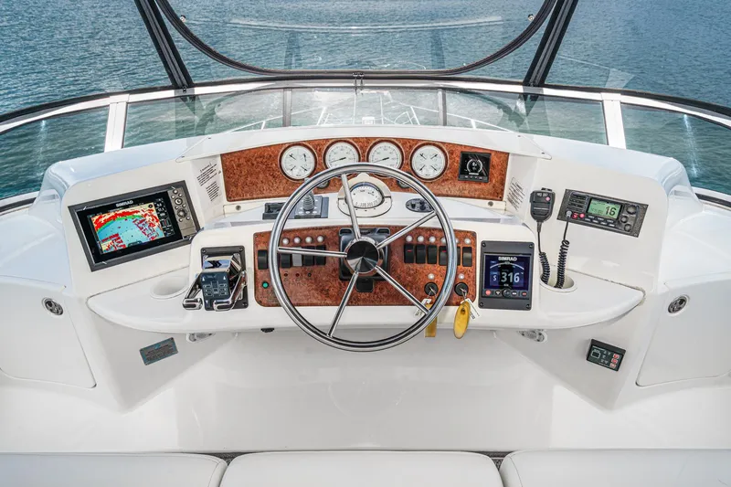 Slide: The Image of Cockpit of 2004 Silverton 39 Motor Yacht with navigation instruments and steering wheel. - 17