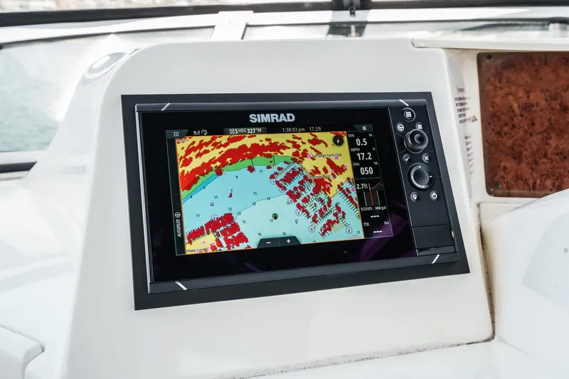 Slide: The Image of Simrad navigation display on 2004 Silverton 39 Motor Yacht dashboard. - 18