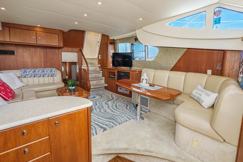 Slide: The Image of Luxurious interior of 2004 Silverton 39 Motor Yacht with plush seating and modern amenities. - 24
