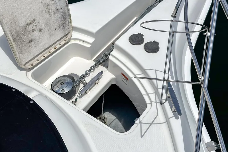 Slide: The Image of 2004 Silverton 39 Motor Yacht anchor compartment with chain and winch. - 35