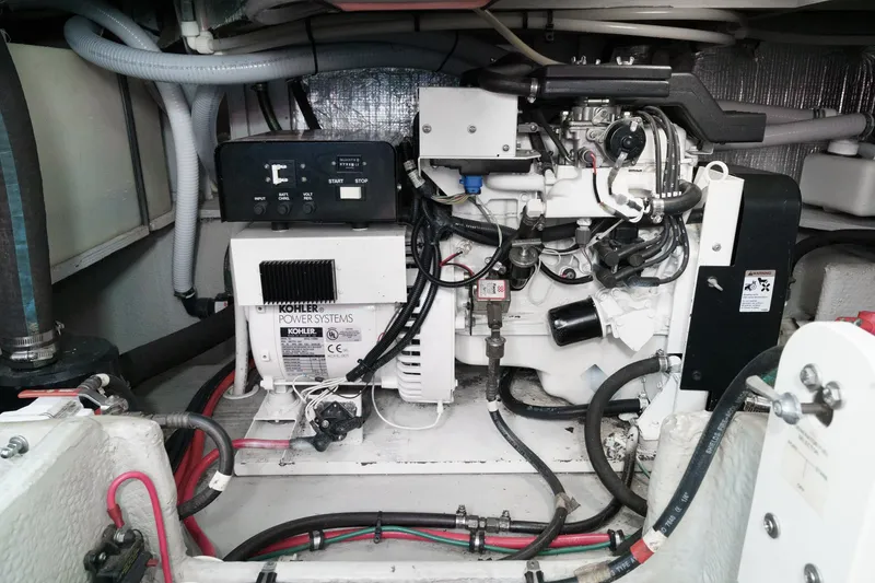 Slide: The Image of Engine room of a 2004 Silverton 39 Motor Yacht, featuring Kohler power systems. - 38
