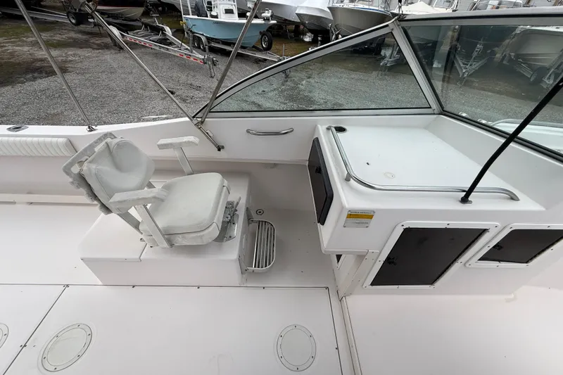 Slide: The Image of Grady-White Freedom 225 boat interior, featuring helm seat and console, year 2000 model. - 12