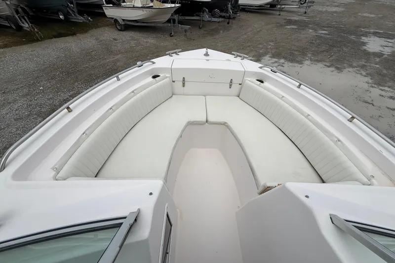 Slide: The Image of 2000 Grady-White Freedom 225 boat with spacious white seating area. - 13