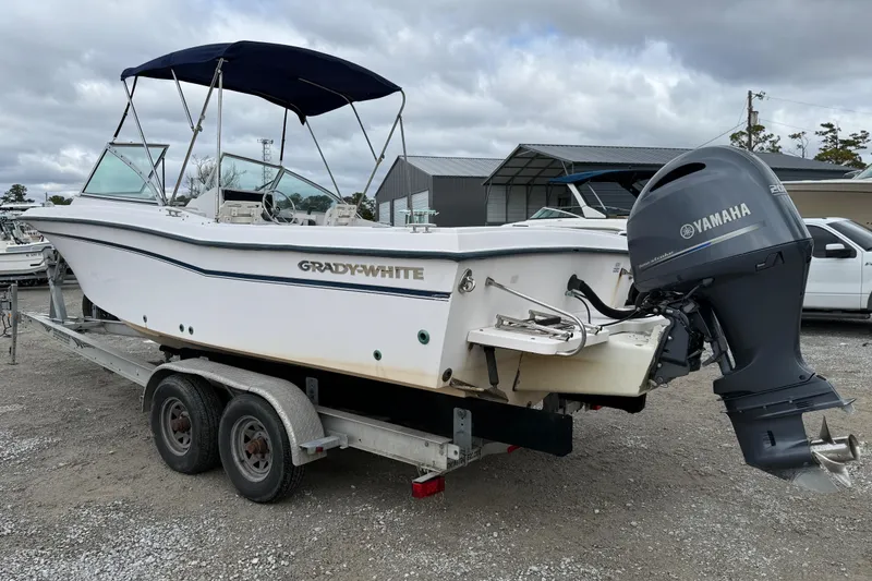 Slide: The Image of 2000 Grady-White Freedom 225 boat on trailer with Yamaha outboard motor. - 5
